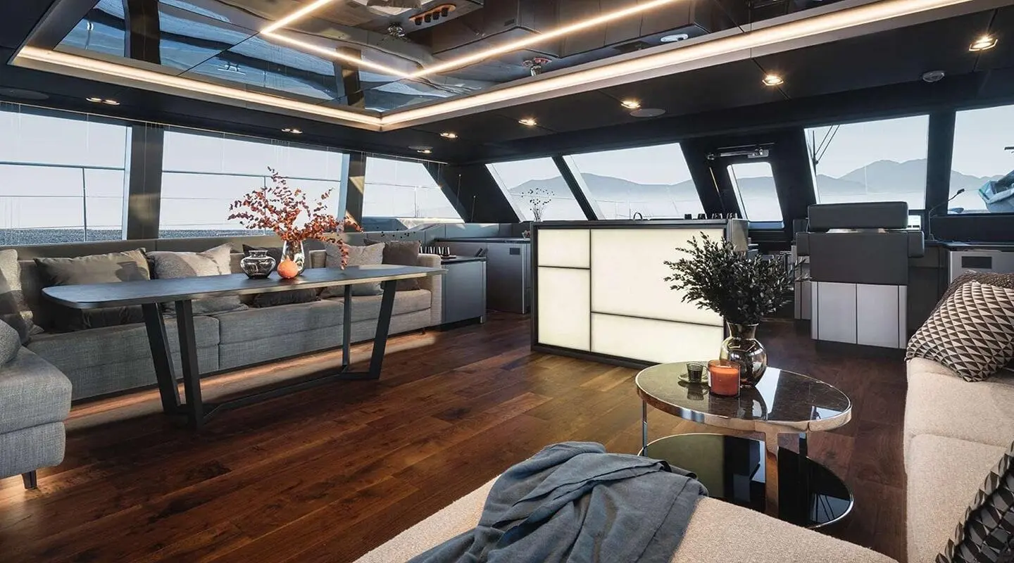 Interior of Alteya yacht: modern lounge area with large windows and seating