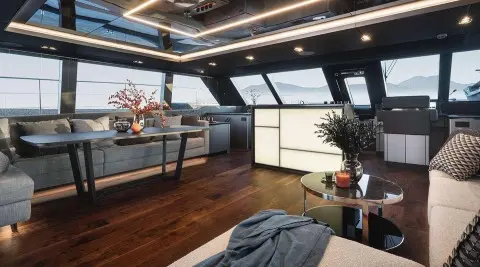 Interior of Alteya yacht: modern lounge area with large windows and seating