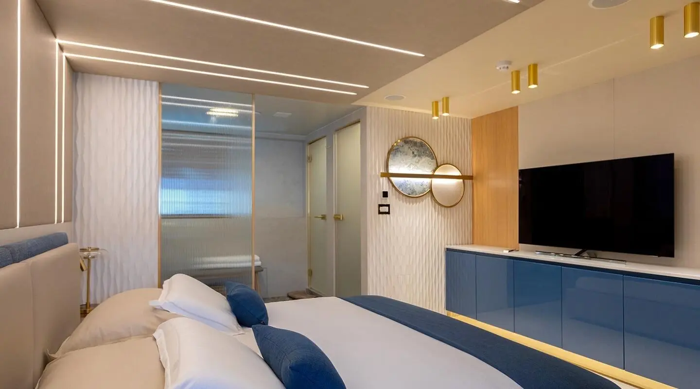 Deck scene aboard Scorpios yacht with seating and navy cushions