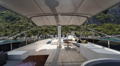 View from yacht deck at sunset with seating and calm blue water