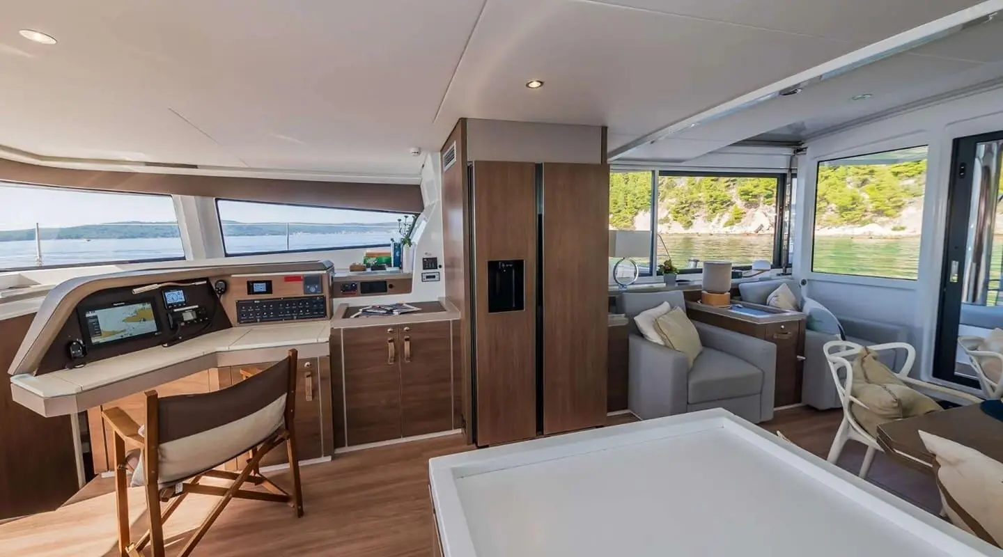 Yacht cockpit aboard Ocean Lounge with seating, wood cabinetry, and windows