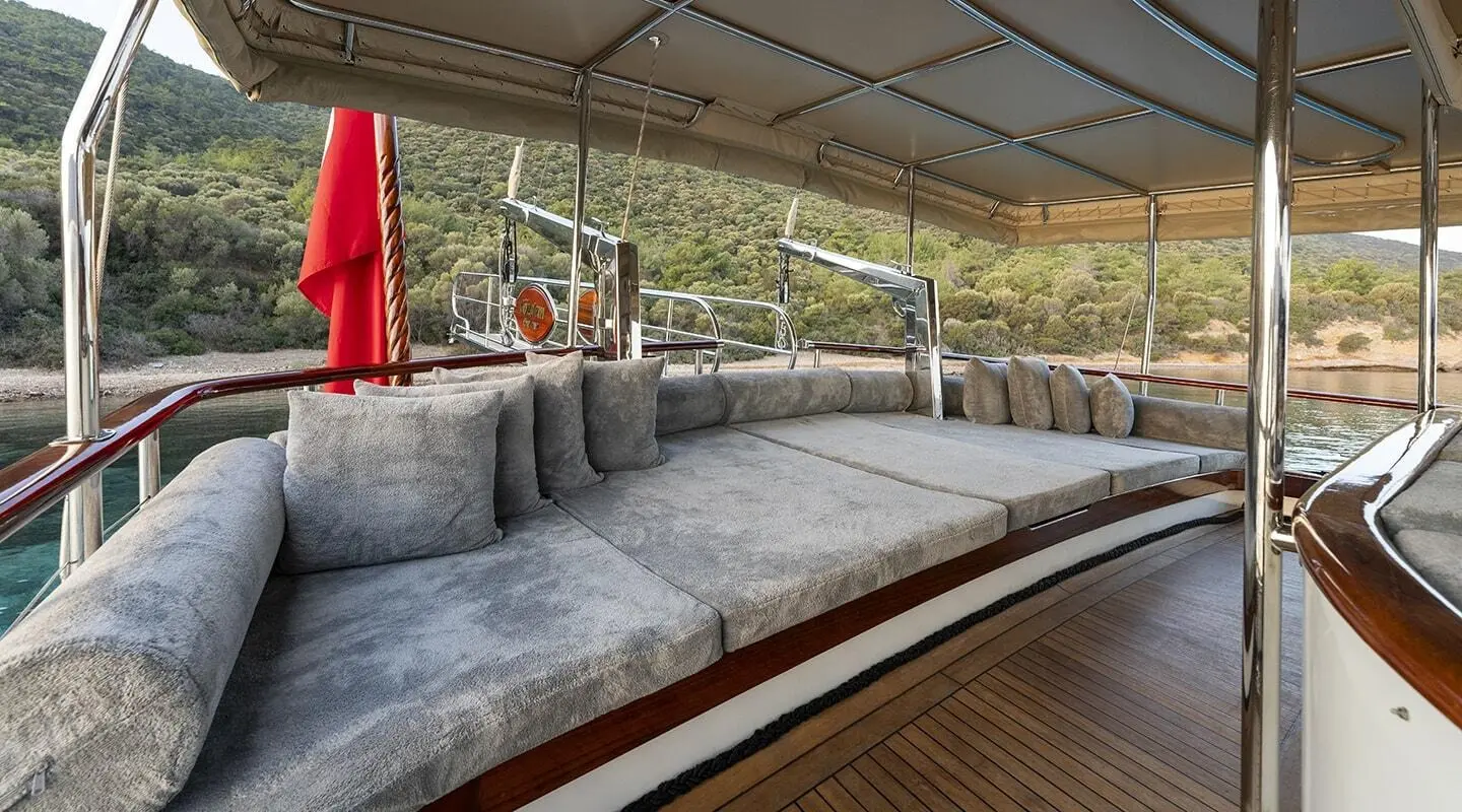 Gozdem The One yacht aft deck with cushioned seating and railing
