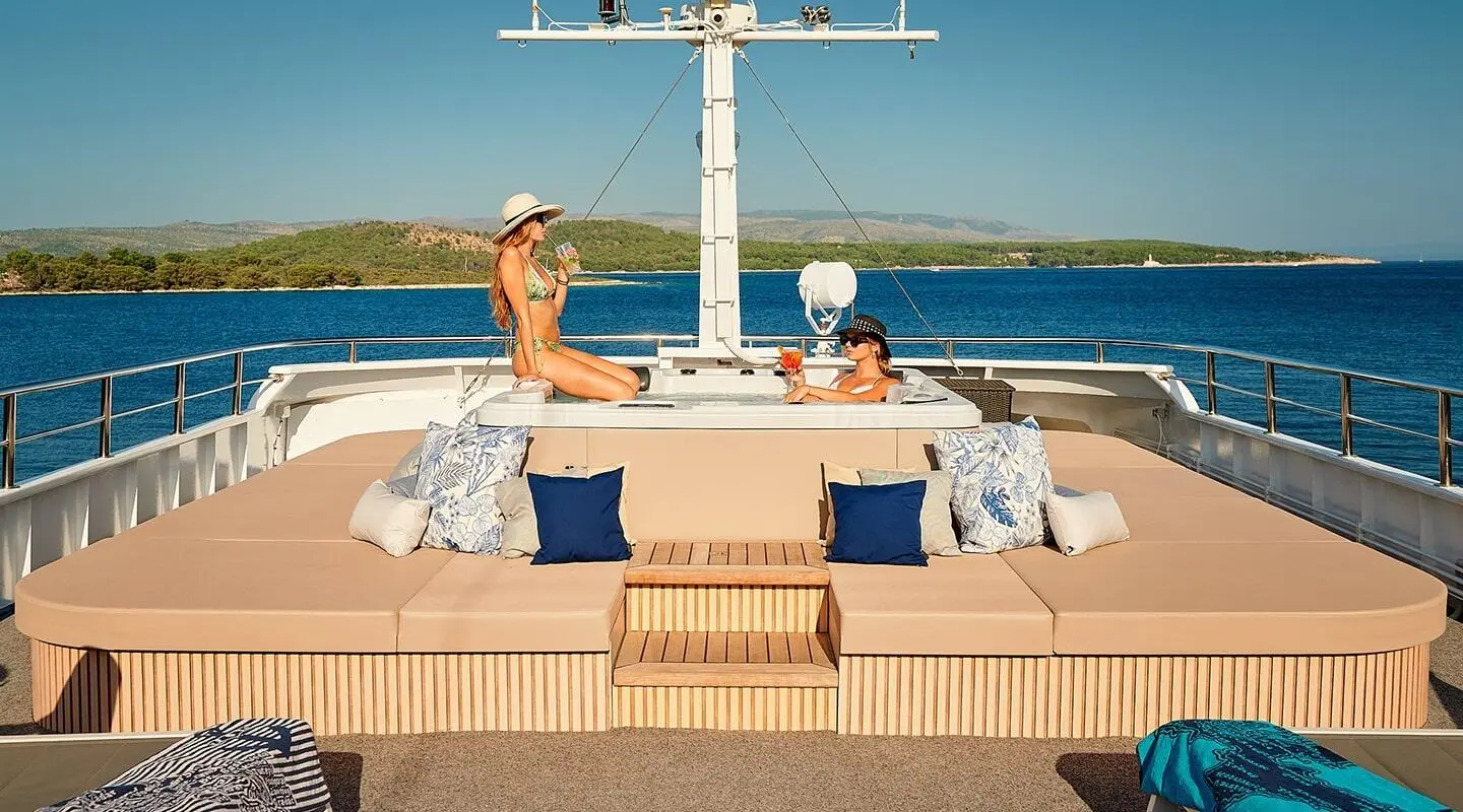 Lupus Mare luxury yacht sun deck with two people relaxing at sea