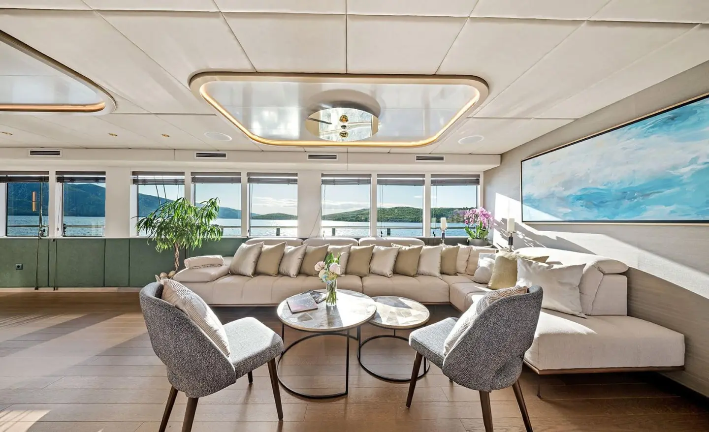 Anima Maris luxury yacht salon at sunset with seating and table setup