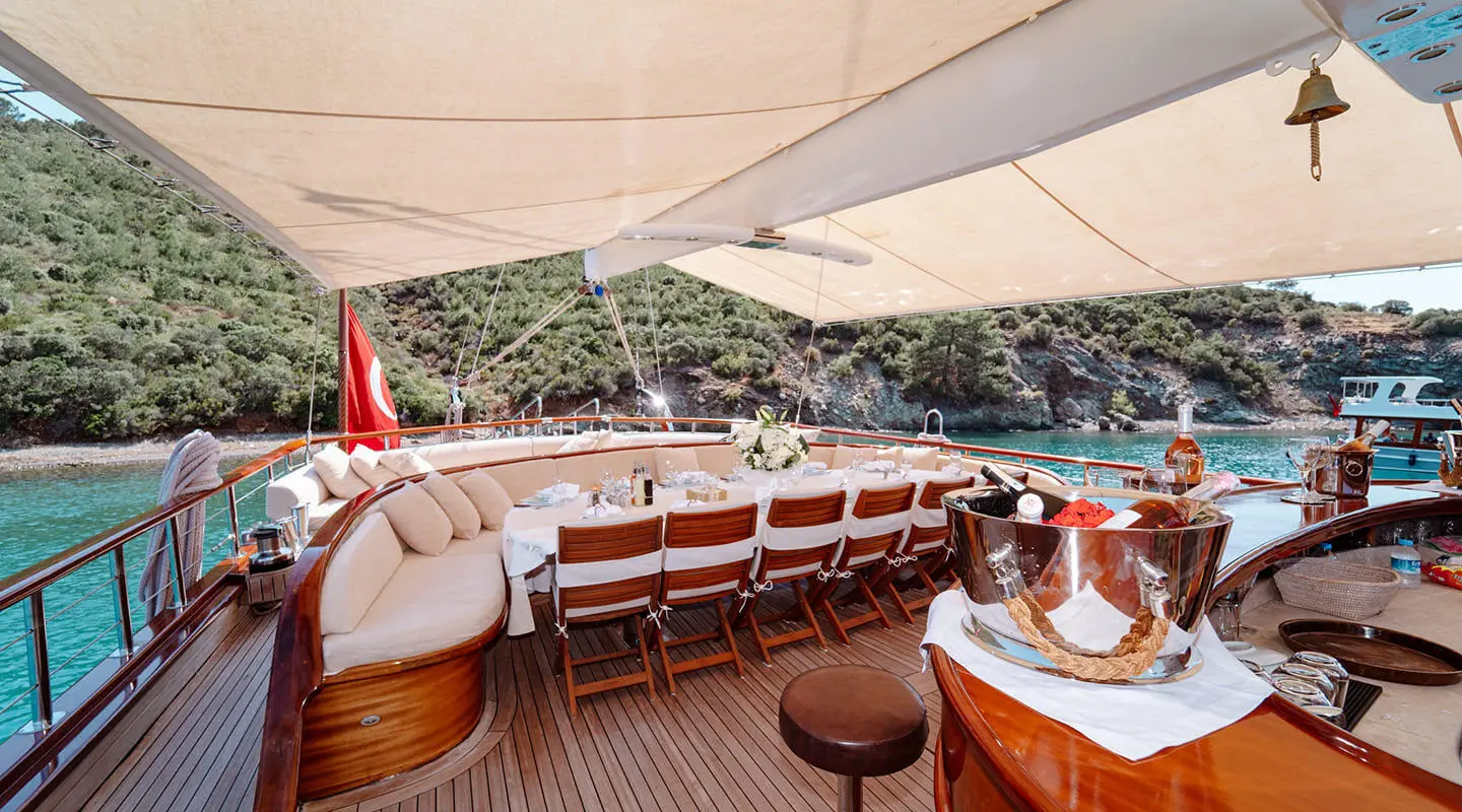 Aft deck of Lycian Queen gulet with wood seating and shaded canopy