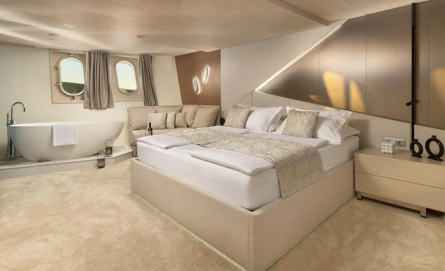 Mistress Cristal master cabin on a yacht with large bed and neutral tones