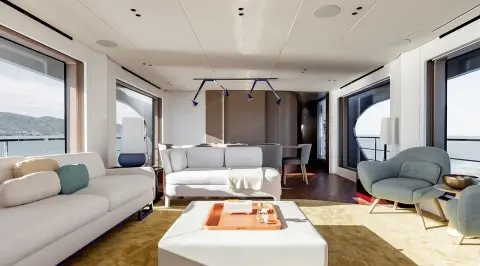 Viva II yacht interior saloon with white sofas and a wooden coffee table