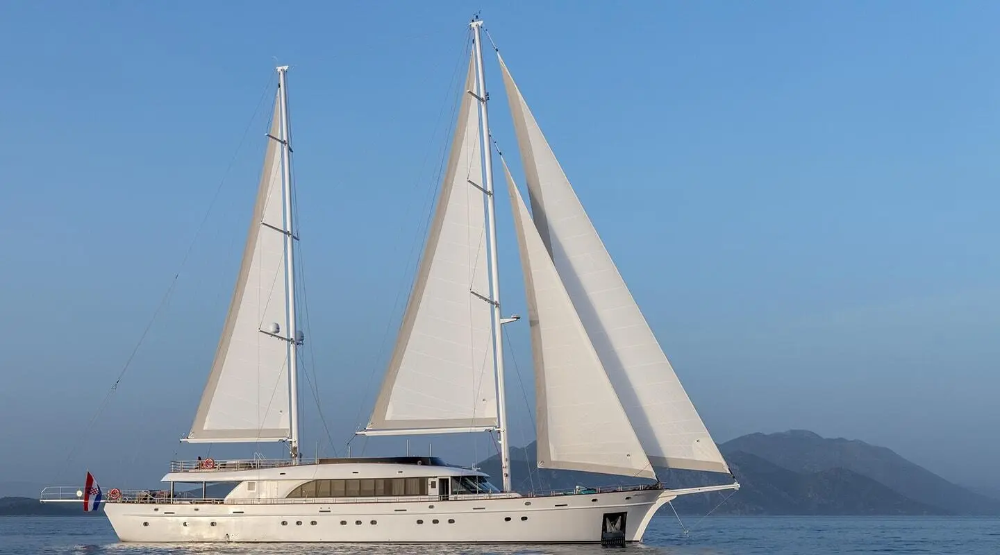 Love Story luxury 43m sailing yacht with white hull and sails on calm blue sea