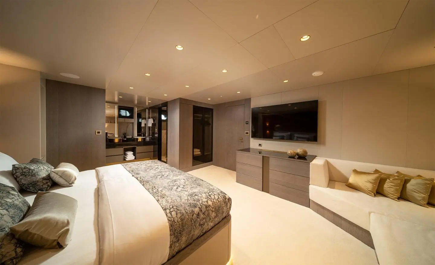 Nocturno luxury yacht bedroom interior with bed, seating, and ambient lighting