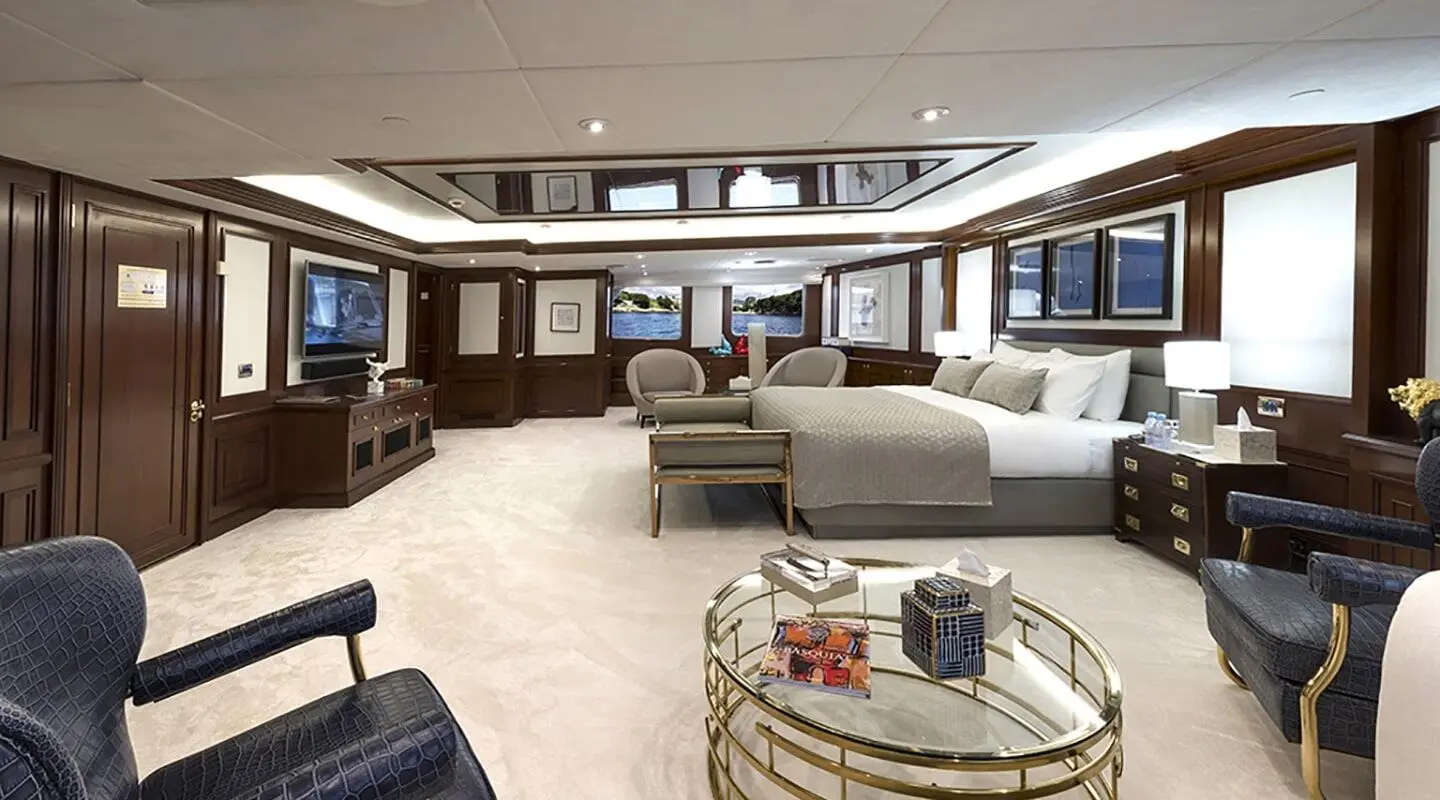 Chakra yacht master cabin exterior view with plush seating and glass doors
