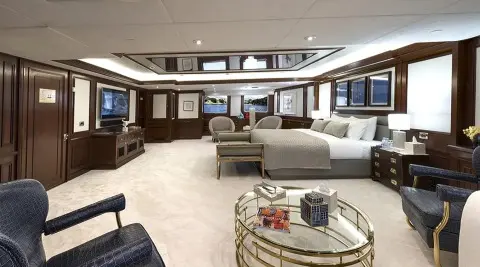 Chakra yacht master cabin exterior view with plush seating and glass doors