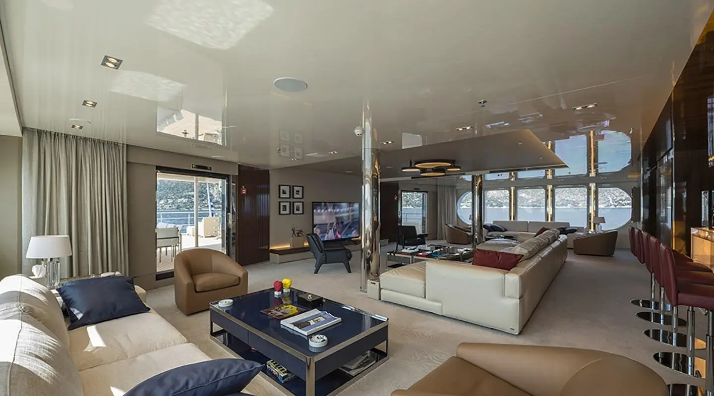 Interior of Marquise yacht salon with seating, coffee table, and windows