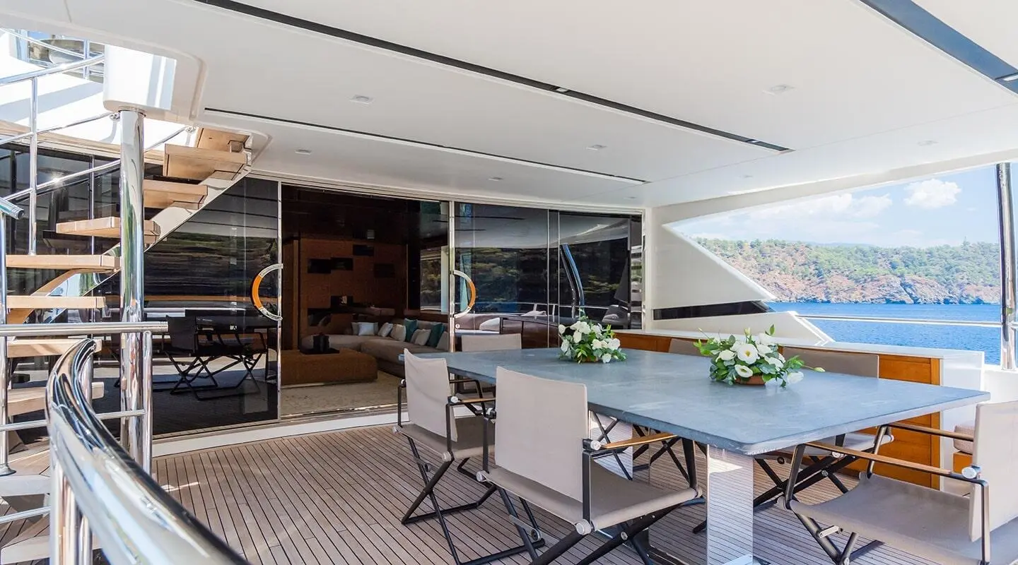 Takara One yacht deck dining area with a built-in bar and seating