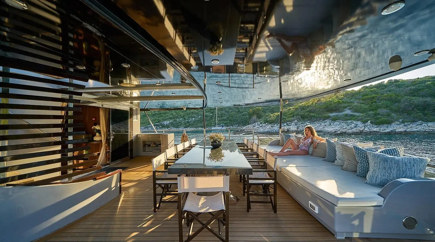 Rara Avis luxury gulet yacht deck at sunset with seating and sea view