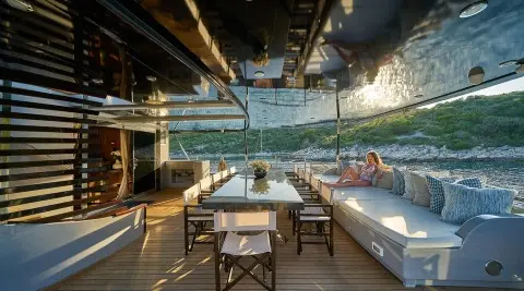 Rara Avis luxury gulet yacht deck at sunset with seating and sea view