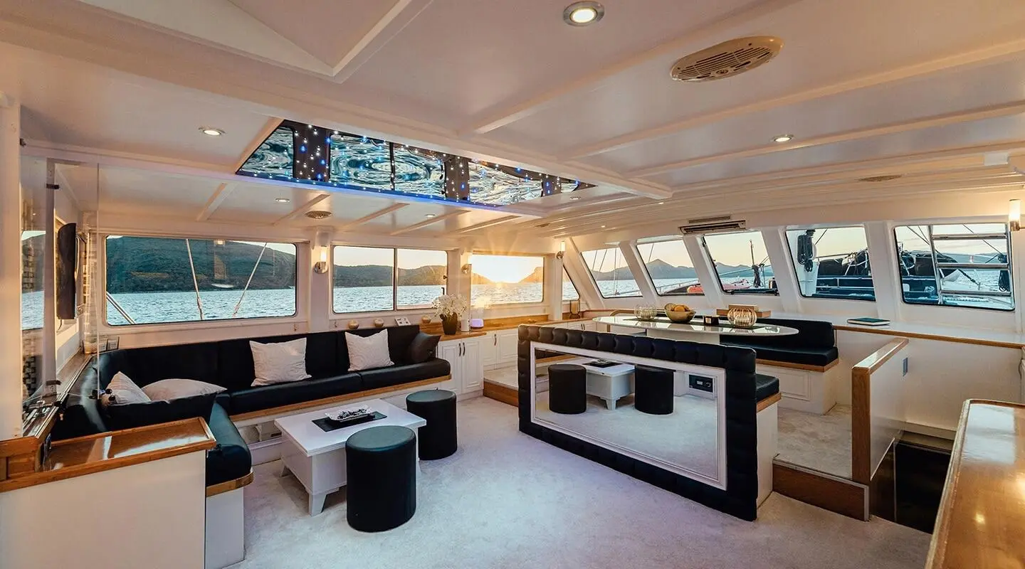 Interior of Maske gulet yacht saloon with seating and large windows