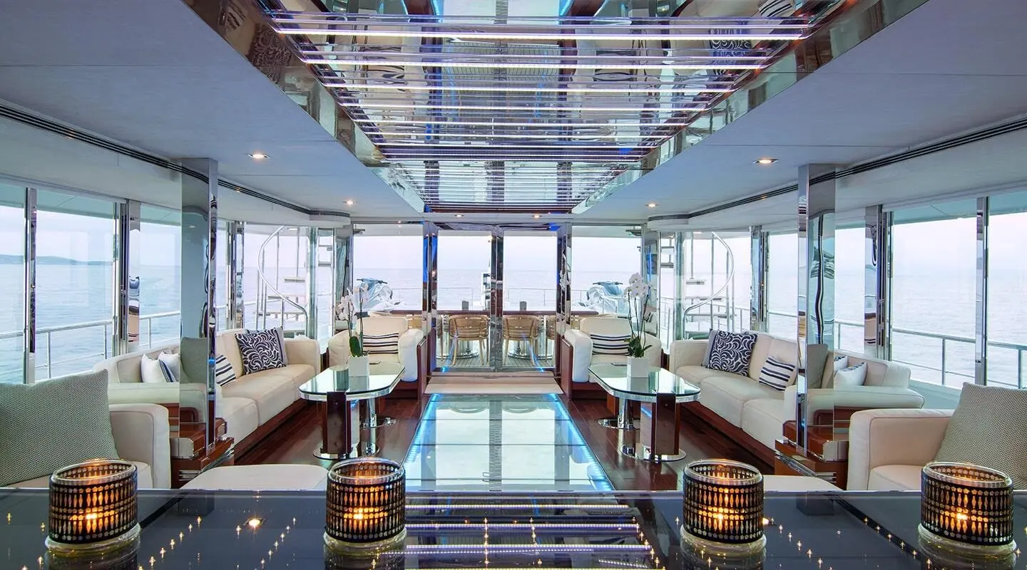 Interior of O'Natalina motor yacht saloon with polished wooden floor and seating