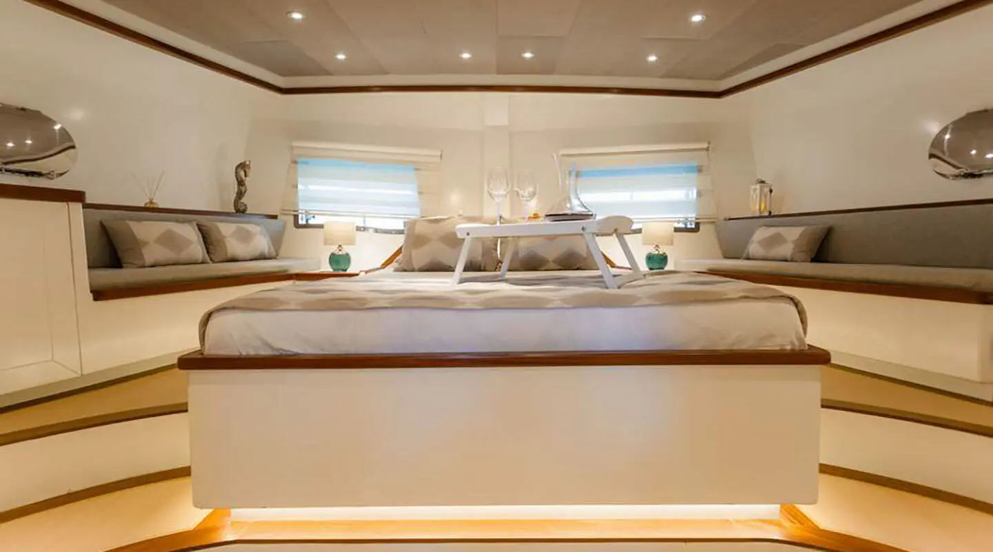 Luxurious Grand Sailor yacht interior with seating and large windows at sunset