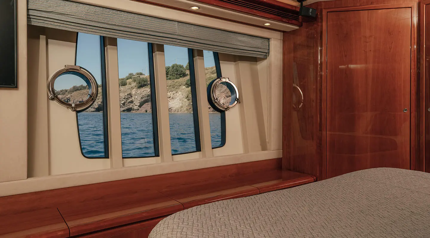Stitched view of a yacht interior window with ocean scenery outside