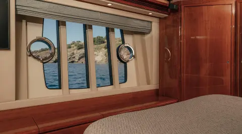 Stitched view of a yacht interior window with ocean scenery outside