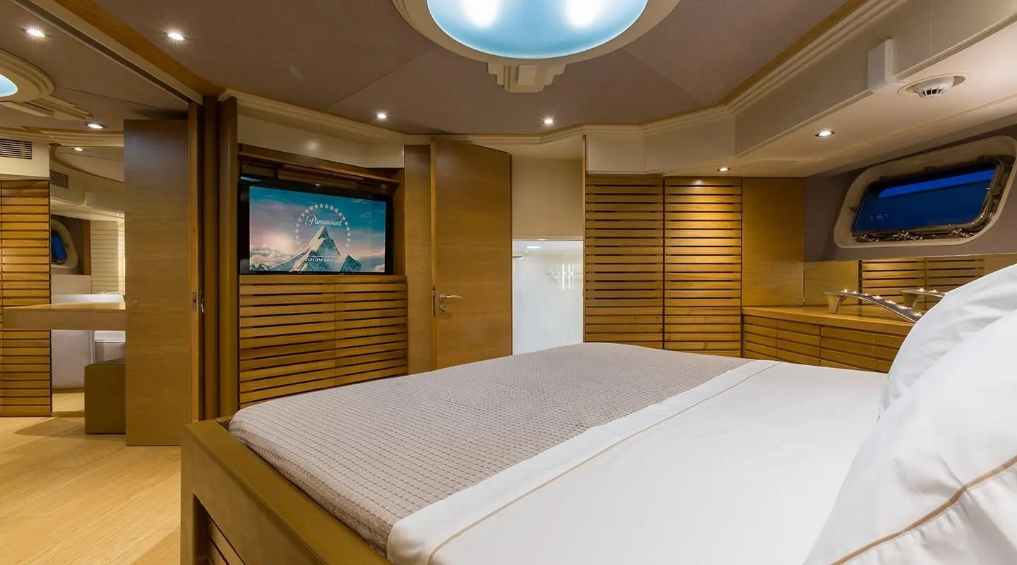Aquarella luxury yacht bed deck inside cabin with warm wood panels and bed