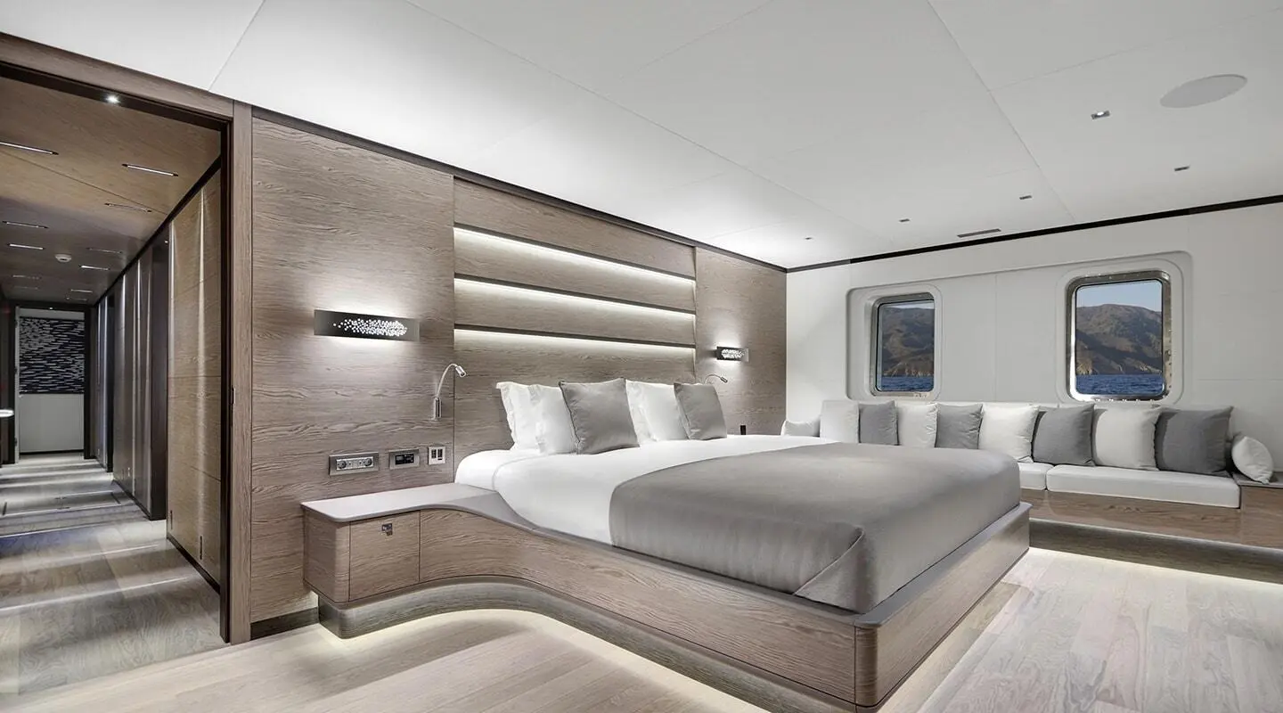 Master cabin aboard All About U 2: large bed, wooden accents, grey bedding
