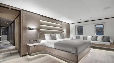 Master cabin aboard All About U 2: large bed, wooden accents, grey bedding