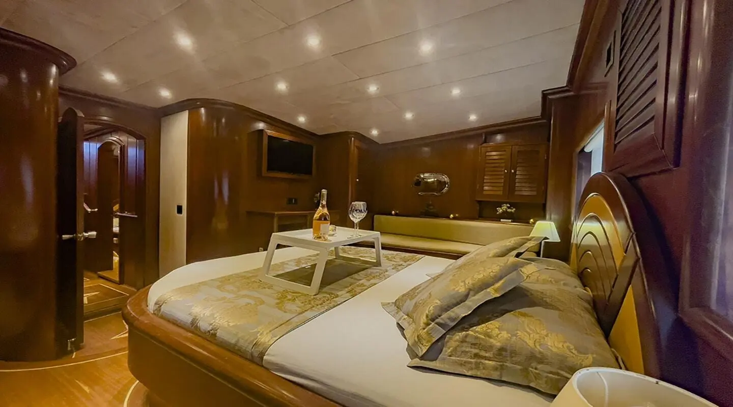 Diva Deniz luxury gulet interior with two beds and warm lighting