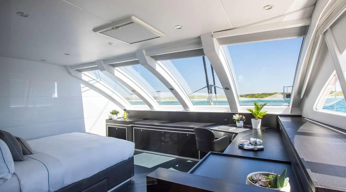 Sunrise on Cartouche luxury motor yacht interior with helm, seating, and panoramic windows