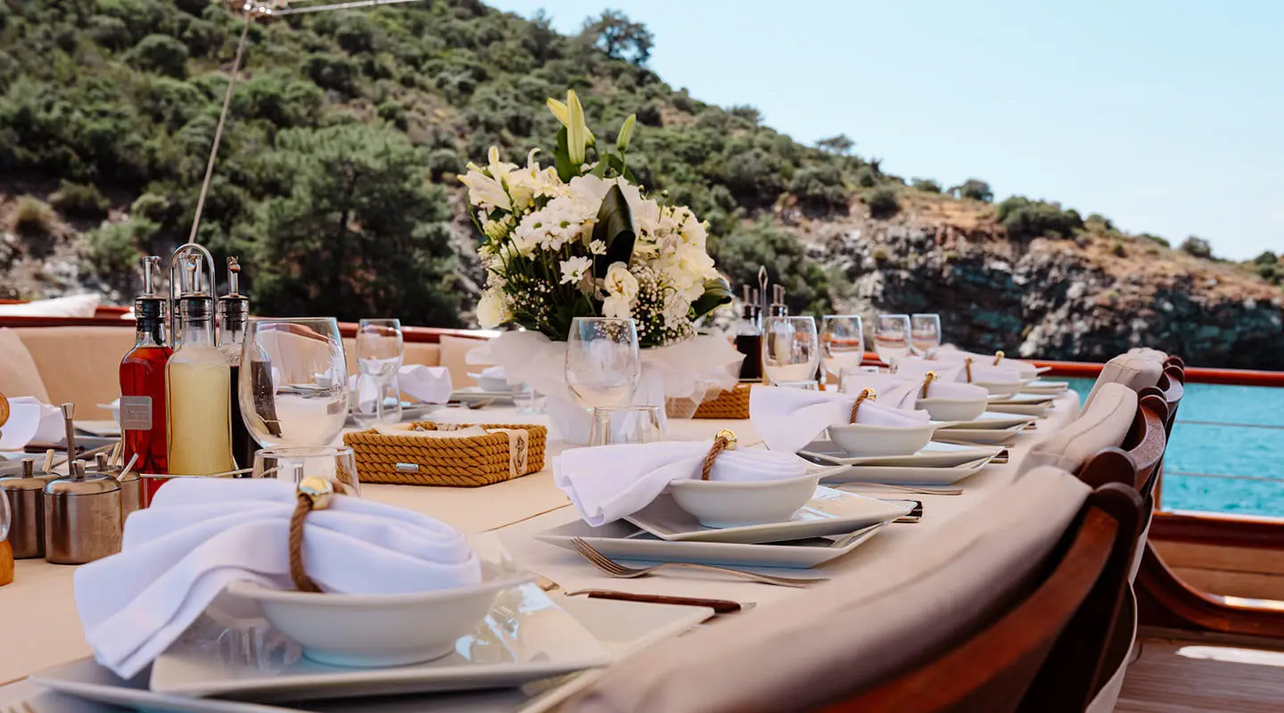 Gulet Lycian Queen yacht deck with sun loungers and table settings