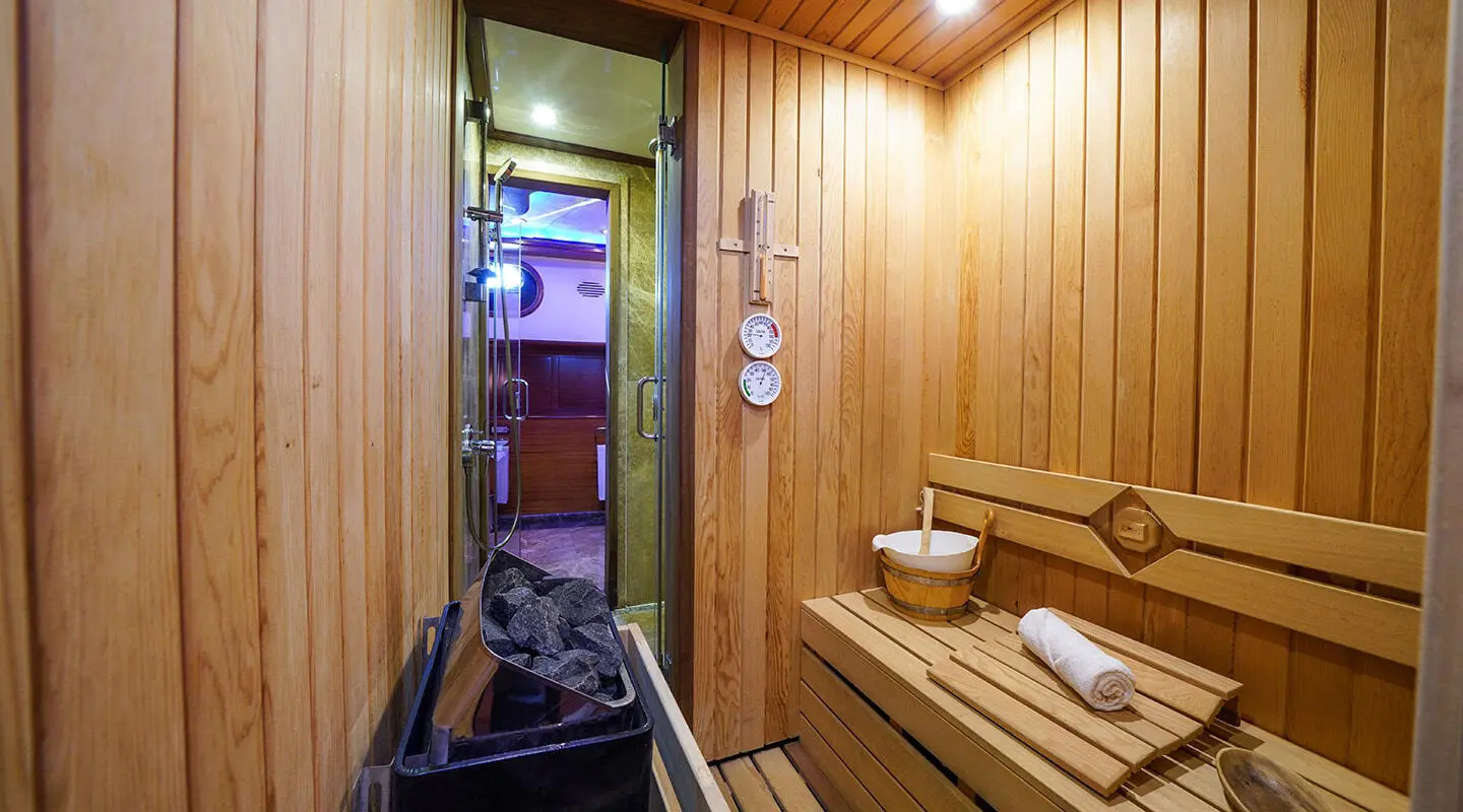Interior sauna aboard La Bella Vita yacht with wooden panels and seating