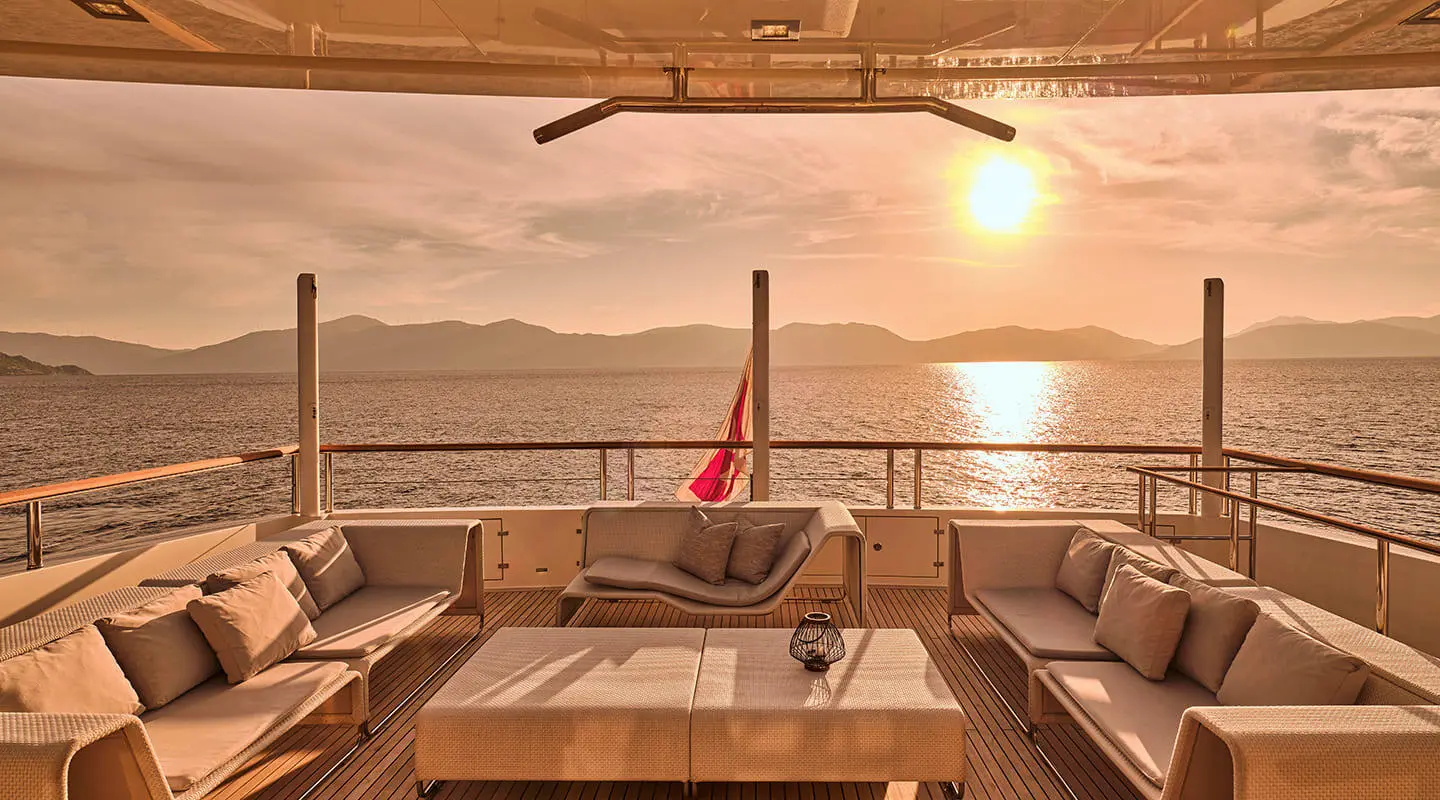 La Pellegrina 1 yacht deck at sunset with seating and ocean view