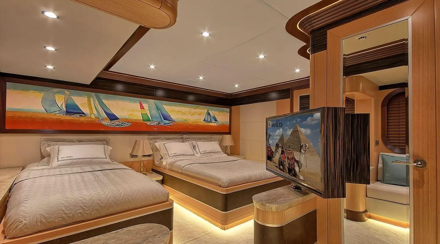 Meira yacht exterior deck with seating, helm area, and light wood tones