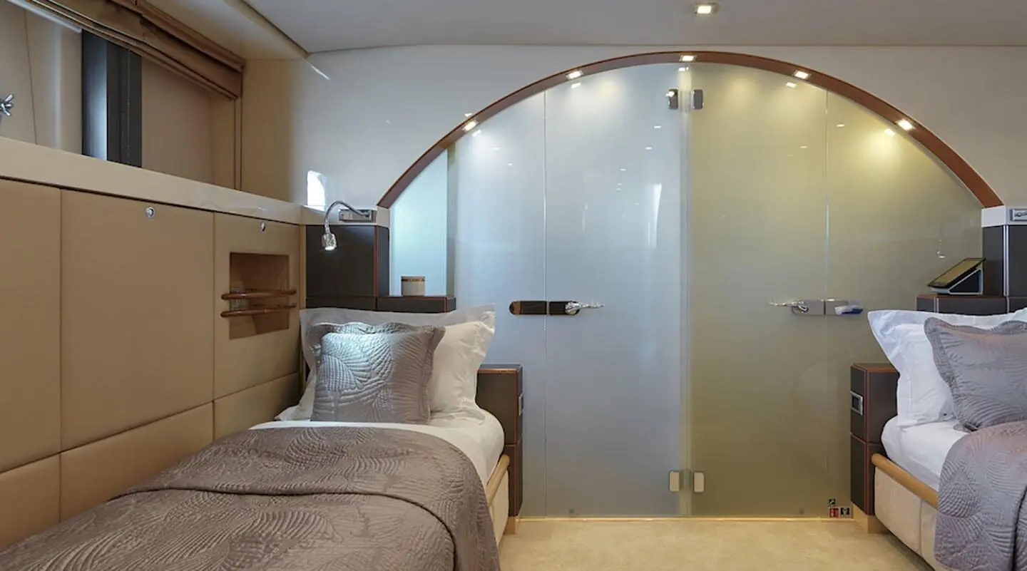 Daloli yacht exterior deck area with glass door and curved interior archway