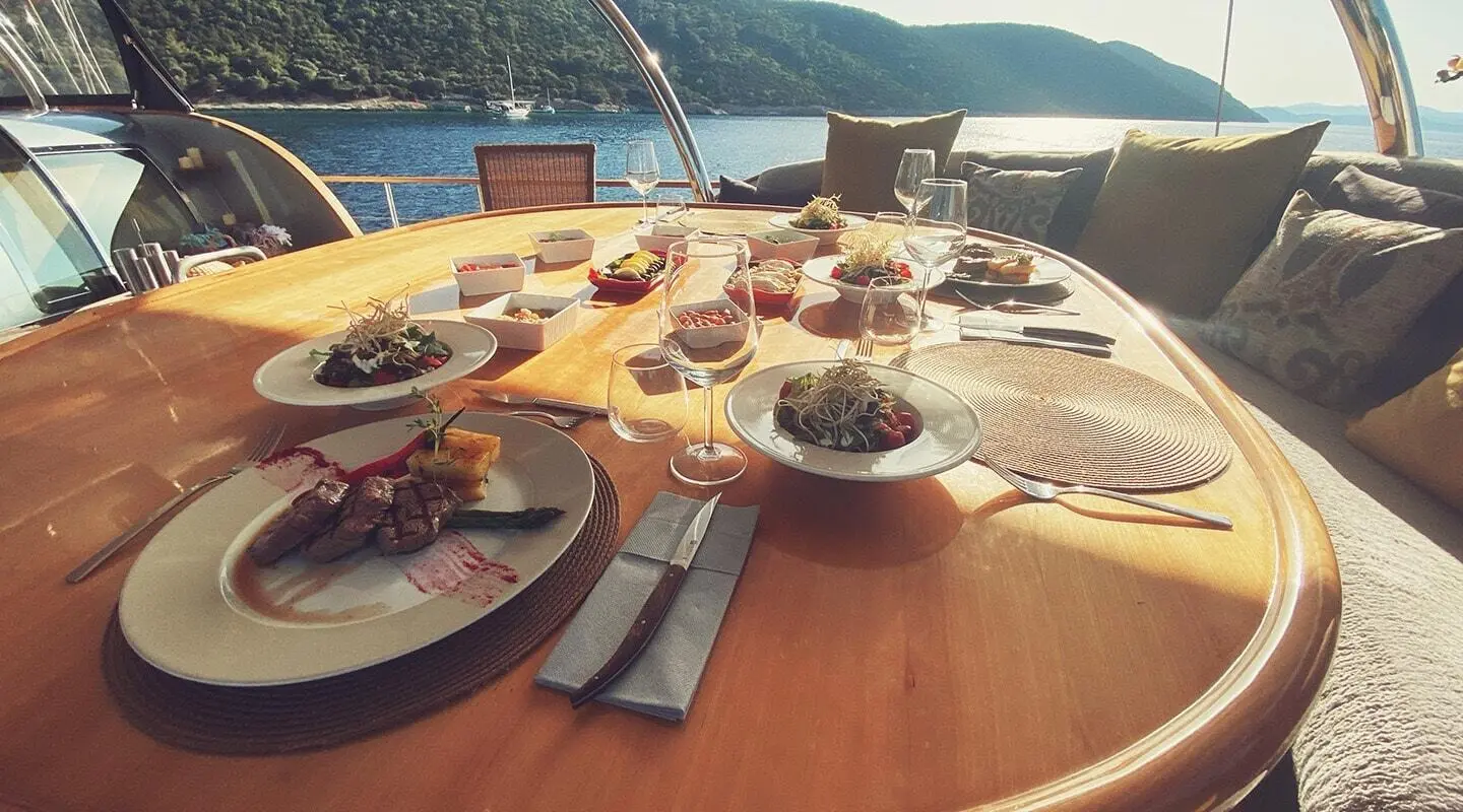 Table set for a yacht charter on Silver Moon with plates and glasses