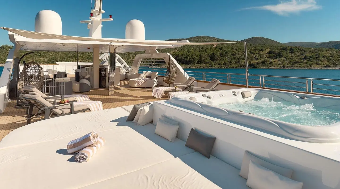 Cristal luxury motor yacht moored with sun deck and white lounge seating