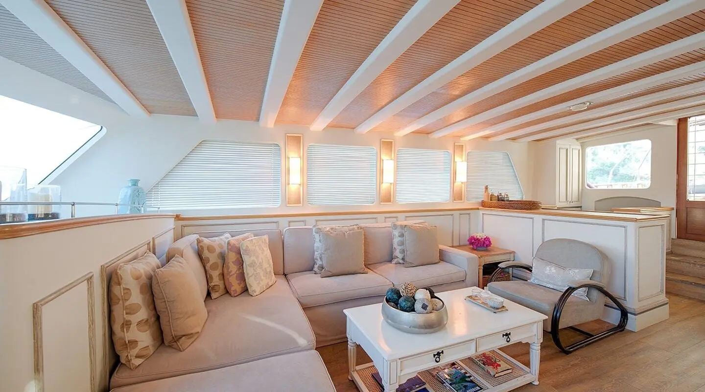 Cobra King yacht saloon interior with cushioned seating and bright windows