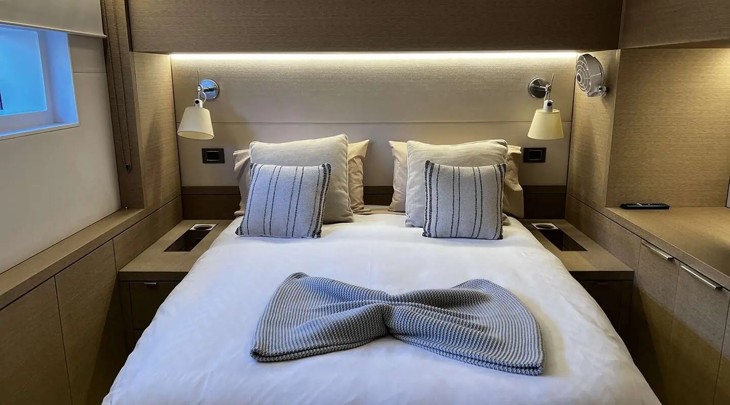 Just Marie 2: double cabin aboard yacht with neatly made bed and pillows