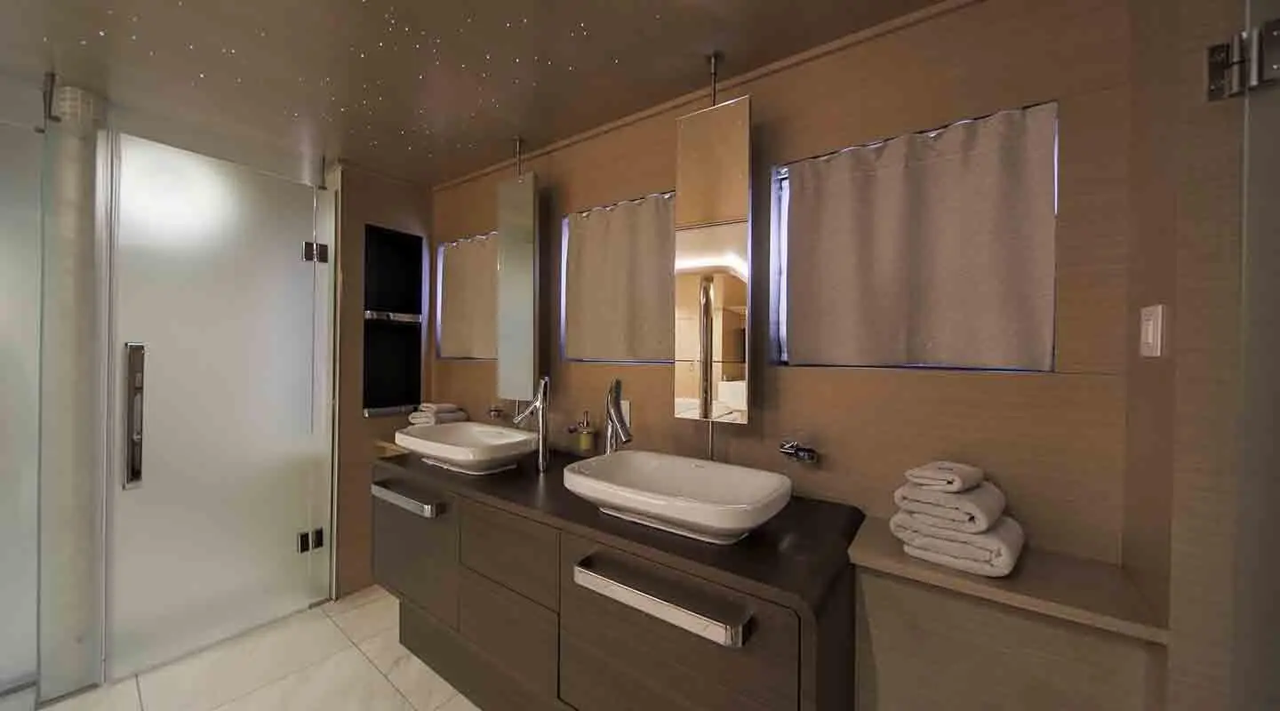 Omnia yacht ensuite bathroom with dual vessel sinks and mirrors