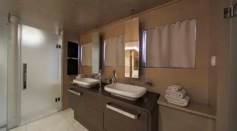Omnia yacht ensuite bathroom with dual vessel sinks and mirrors