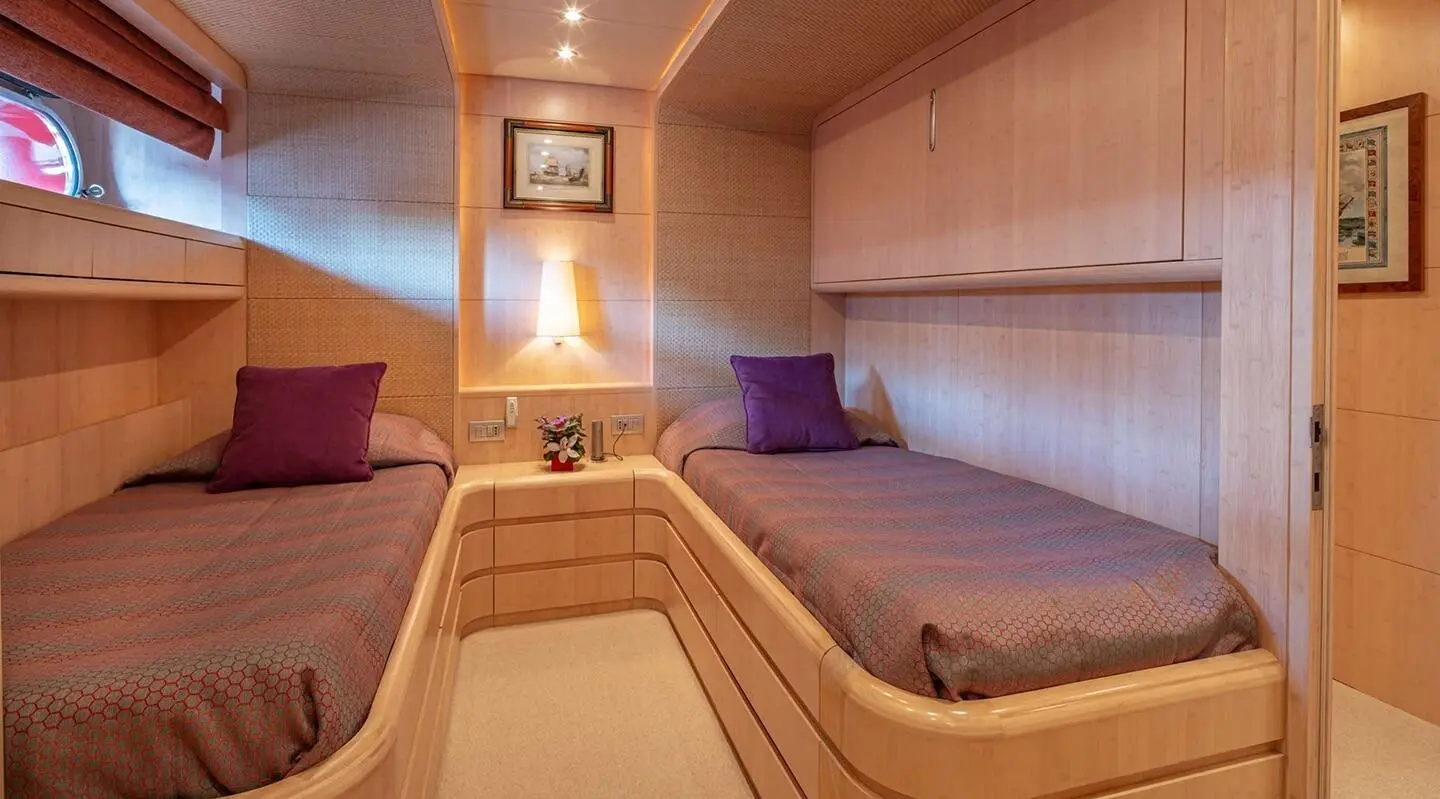 Glaros yacht interior cabin with curved seating and warm lighting