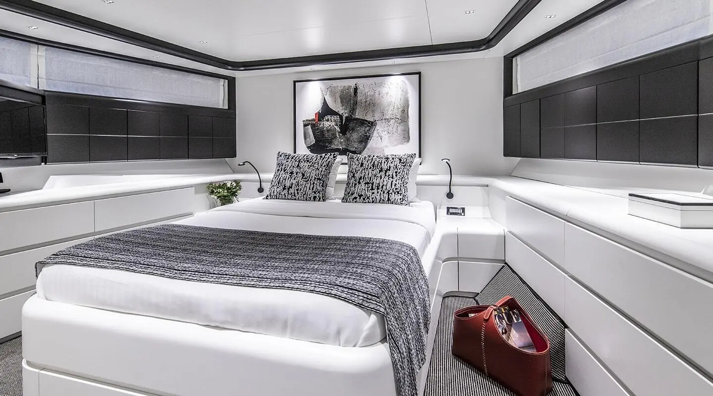 White master cabin on a yacht with modern decor and bed