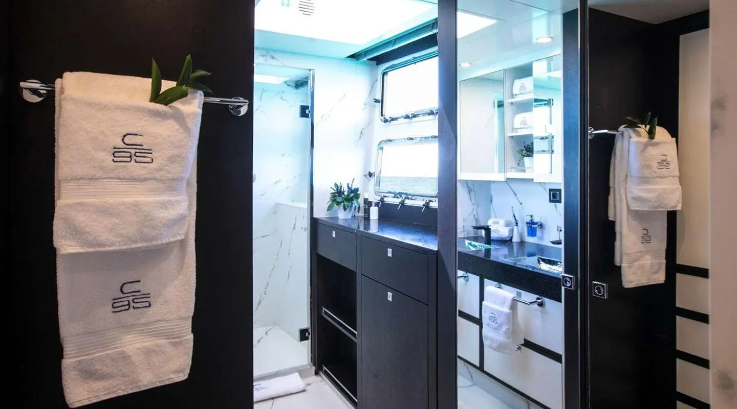 Yacht Cartouche bathroom interior with sink, mirror, and storage cabinets