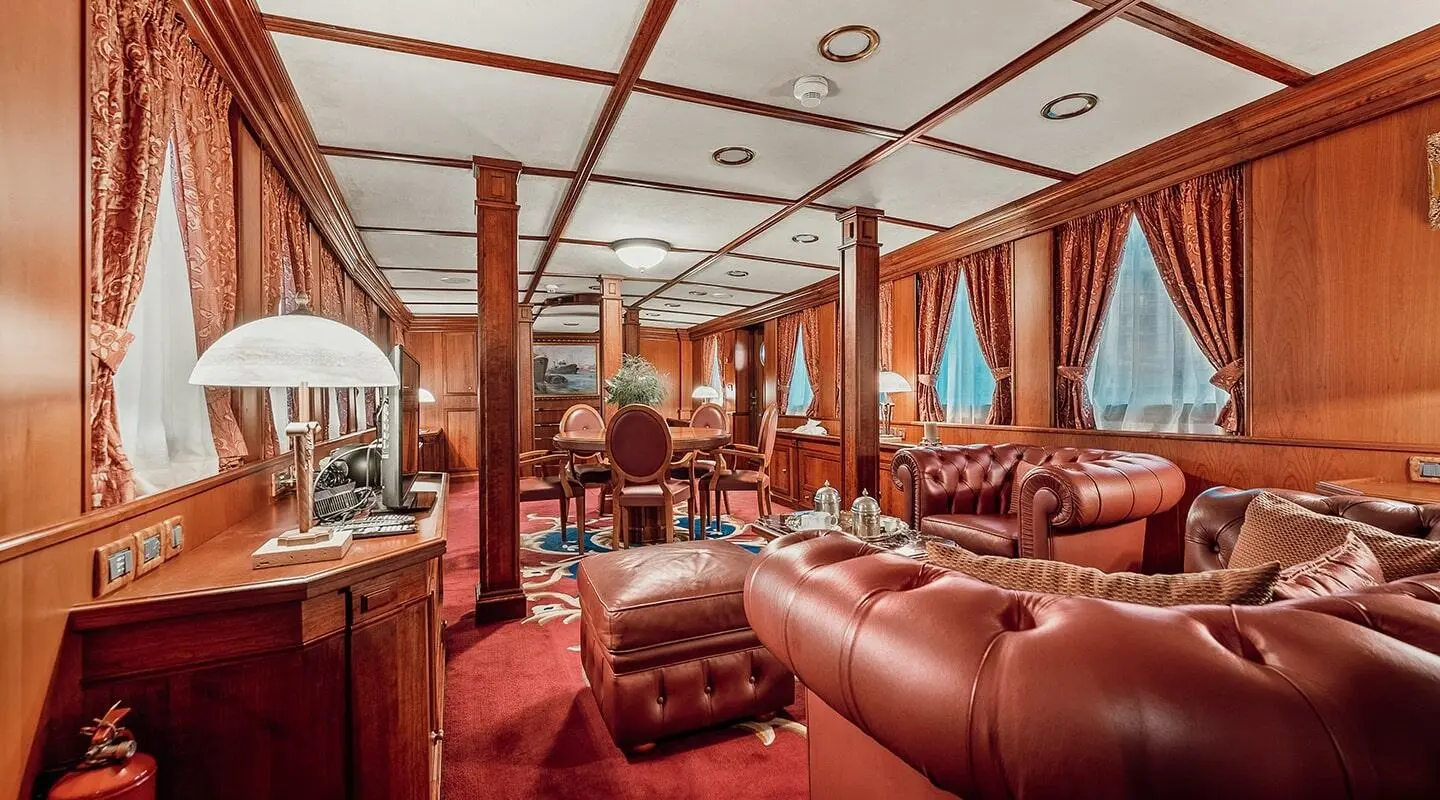 Interior of Seagull II luxury yacht with red leather seating and wood paneling