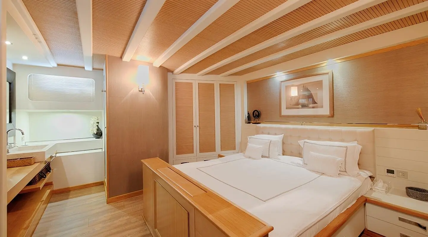 Cobra King yacht cabin with double bed, wooden interior, soft lighting