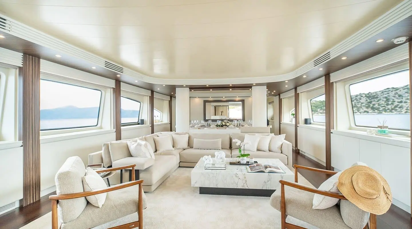 Pareaki II lounge deck: airy seating, neutral tones, large windows, sunlit