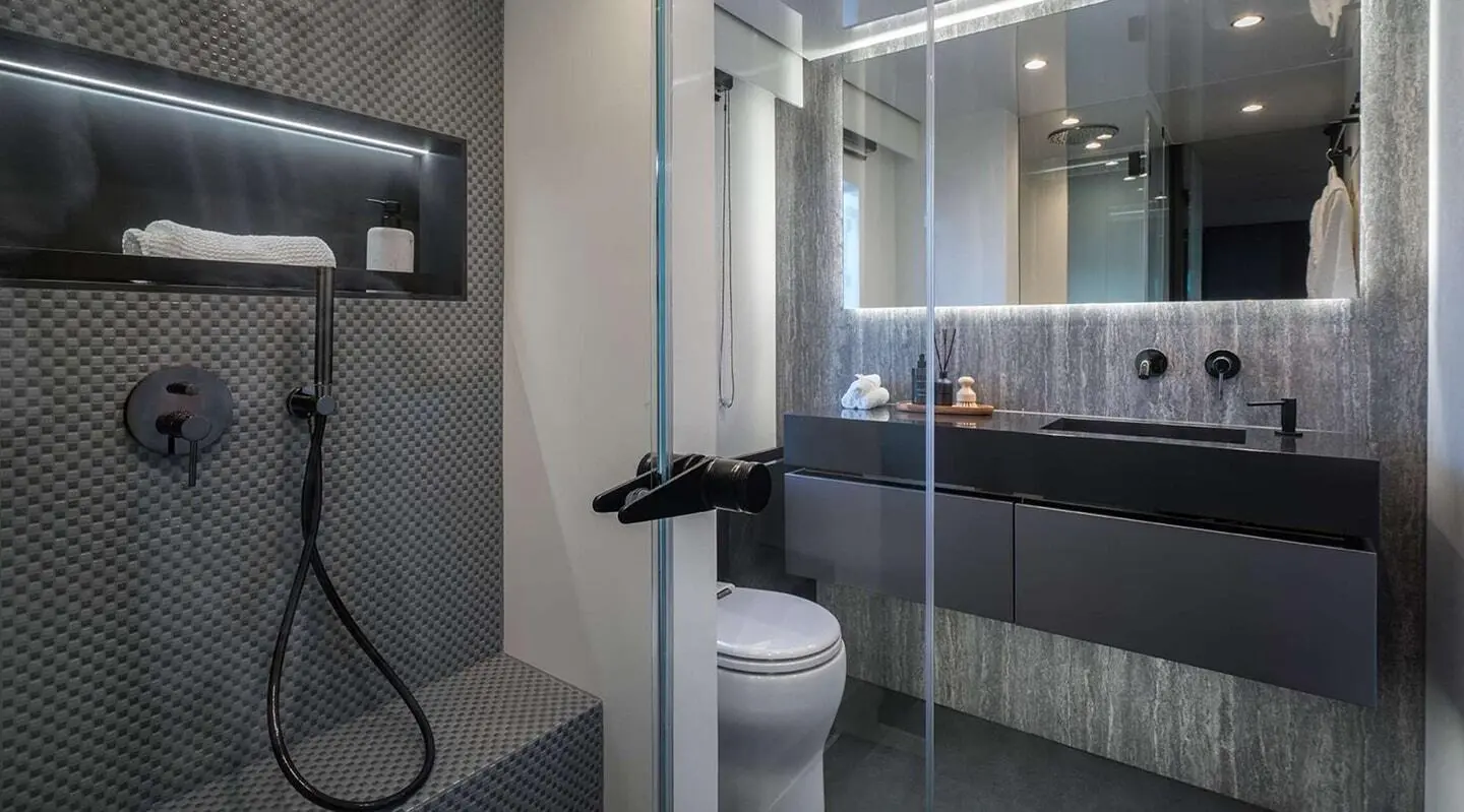 Luxurious yacht Alteya deck area with glass shower and modern interiors