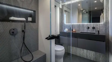 Luxurious yacht Alteya deck area with glass shower and modern interiors