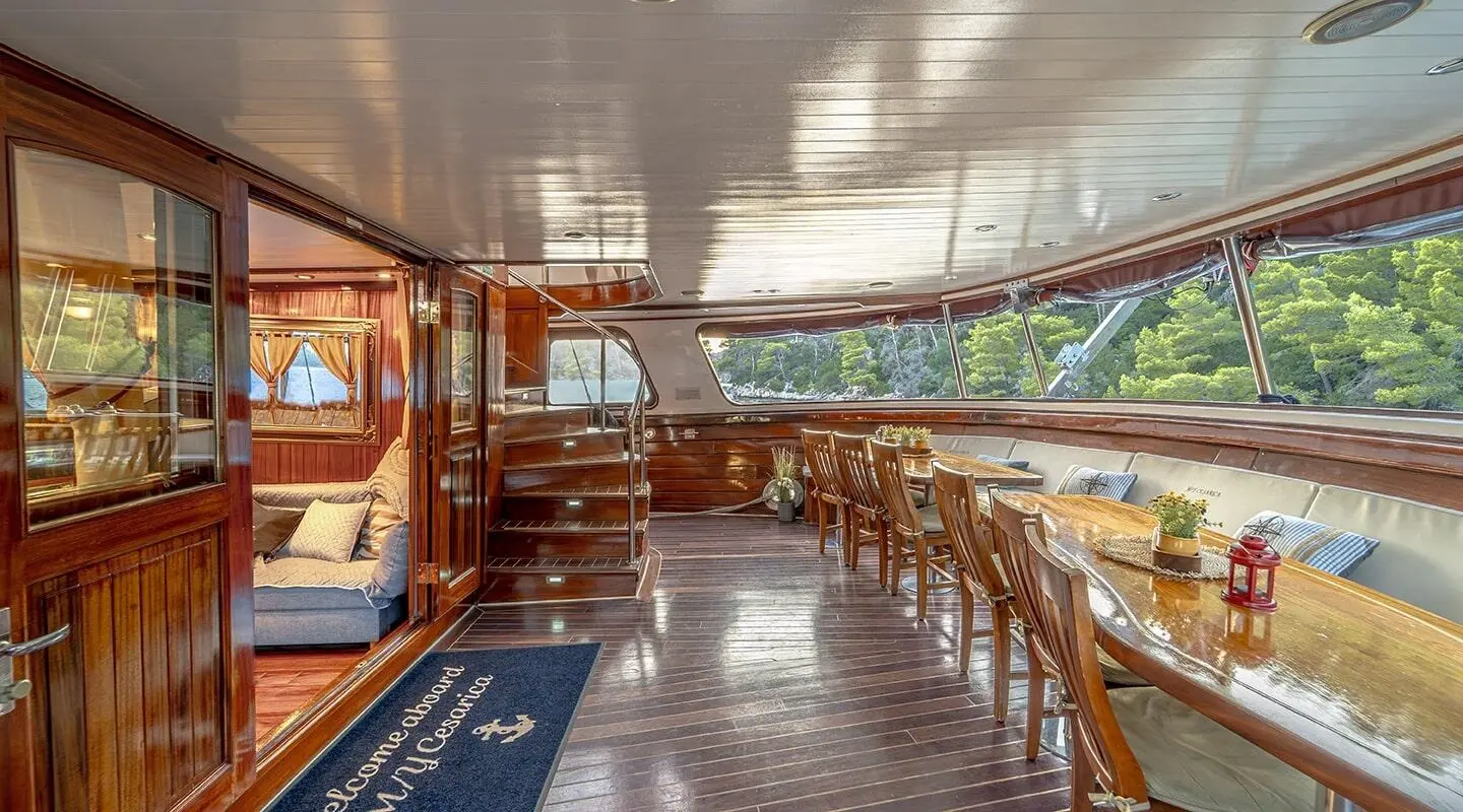 Cesarica luxury gulet at sunset yacht deck with wooden railing and seating