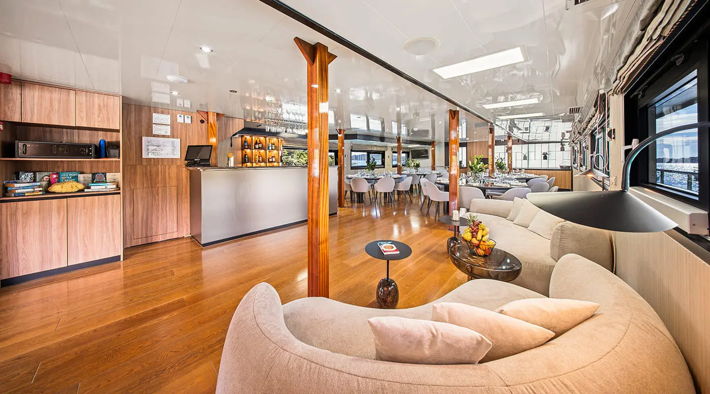 Karizma yacht saloon deck interior with seating area and wood accents